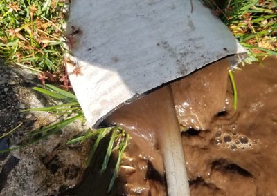 blocked storm drain on residential property, from our gallery